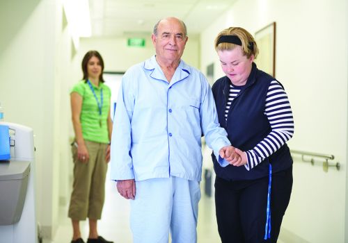 Austin Nurses mobilising patient High Res - 1000px